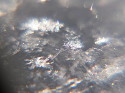Snow crystals glittering in strong direct sunlight 39