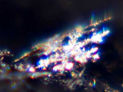 Snow crystals glittering in strong direct sunlight 43 - tight crop - high contrast