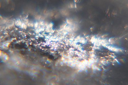 Snow crystals glittering in strong direct sunlight 48 - cropped