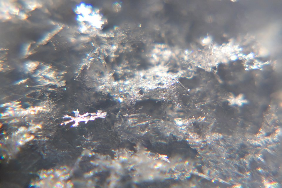 Snow crystals glittering in strong direct sunlight 07 - 08 - cropped