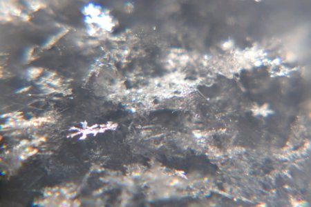 Snow crystals glittering in strong direct sunlight 07 - 08 - cropped
