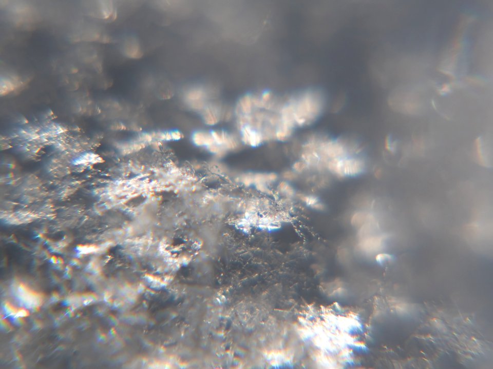 Snow crystals glittering in strong direct sunlight 28