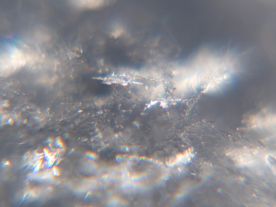Snow crystals glittering in strong direct sunlight 42