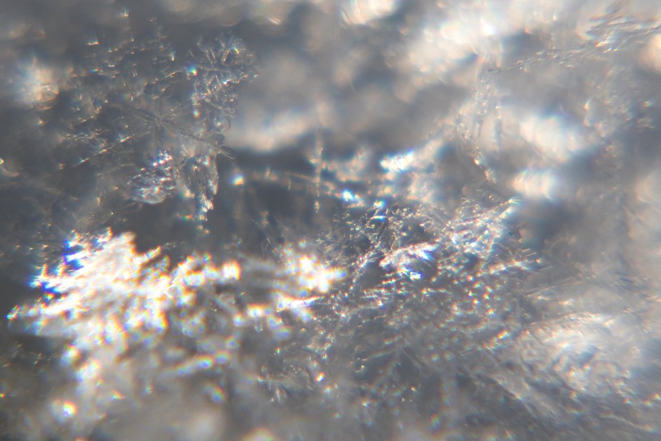 Snow crystals glittering in strong direct sunlight 29 - cropped
