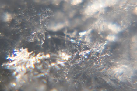 Snow crystals glittering in strong direct sunlight 29 - cropped