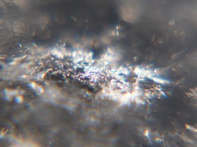 Snow crystals glittering in strong direct sunlight 48