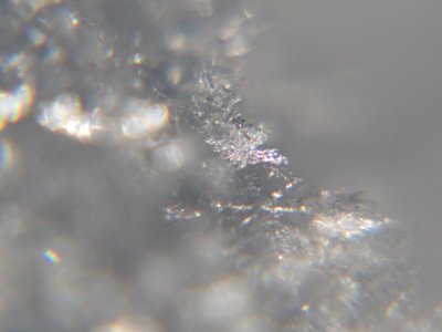Snow crystals glittering in strong direct sunlight 38