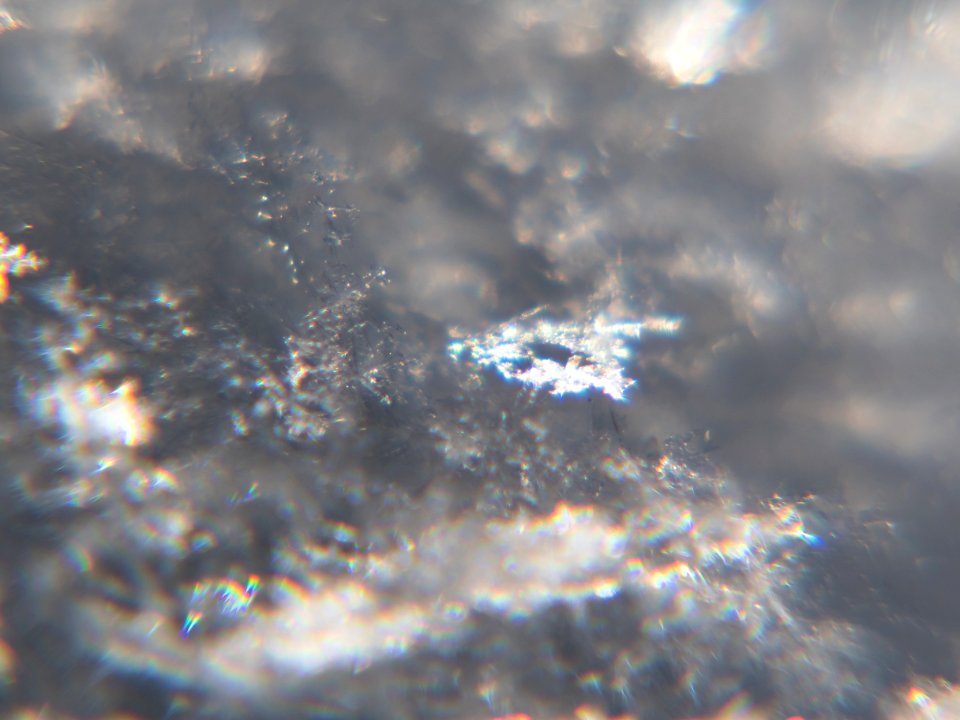 Snow crystals glittering in strong direct sunlight 20