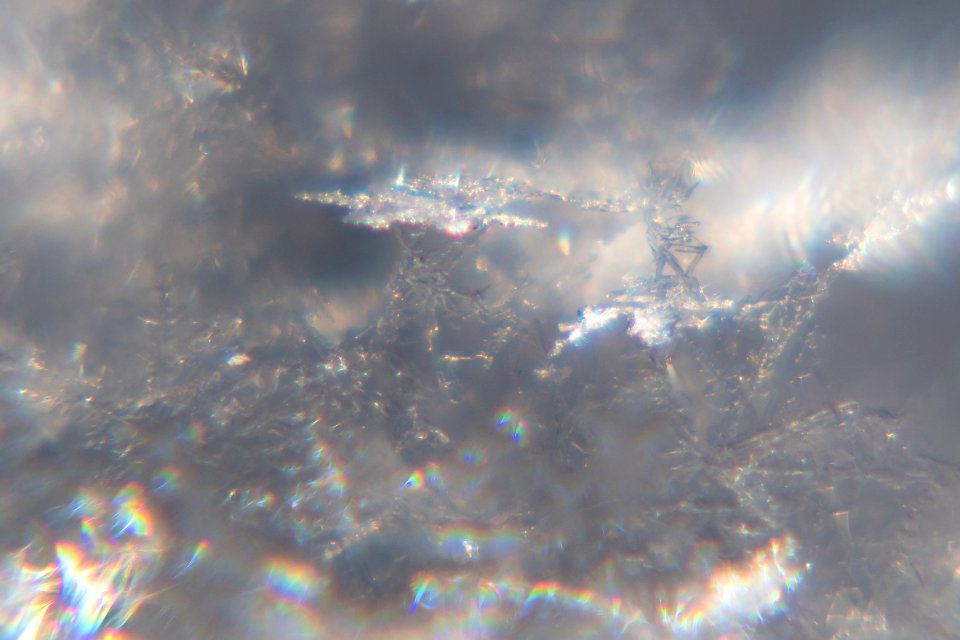 Snow crystals glittering in strong direct sunlight 42 - cropped