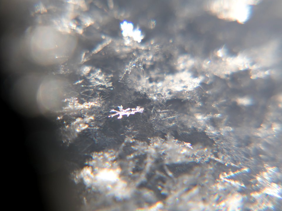 Snow crystals glittering in strong direct sunlight 08