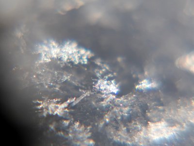 Snow crystals glittering in strong direct sunlight 23