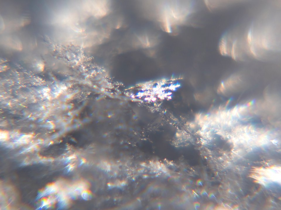 Snow crystals glittering in strong direct sunlight 43