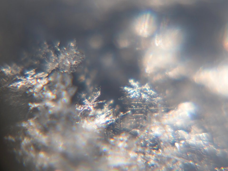 Snow crystals glittering in strong direct sunlight 03