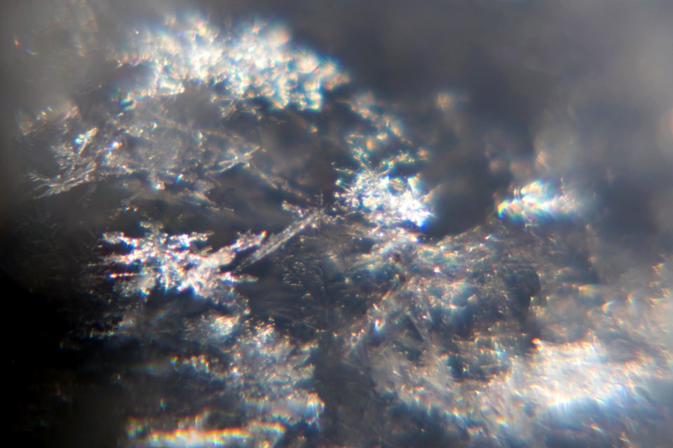 Snow crystals glittering in strong direct sunlight 21 - 22 - 23 - cropped - high contrast