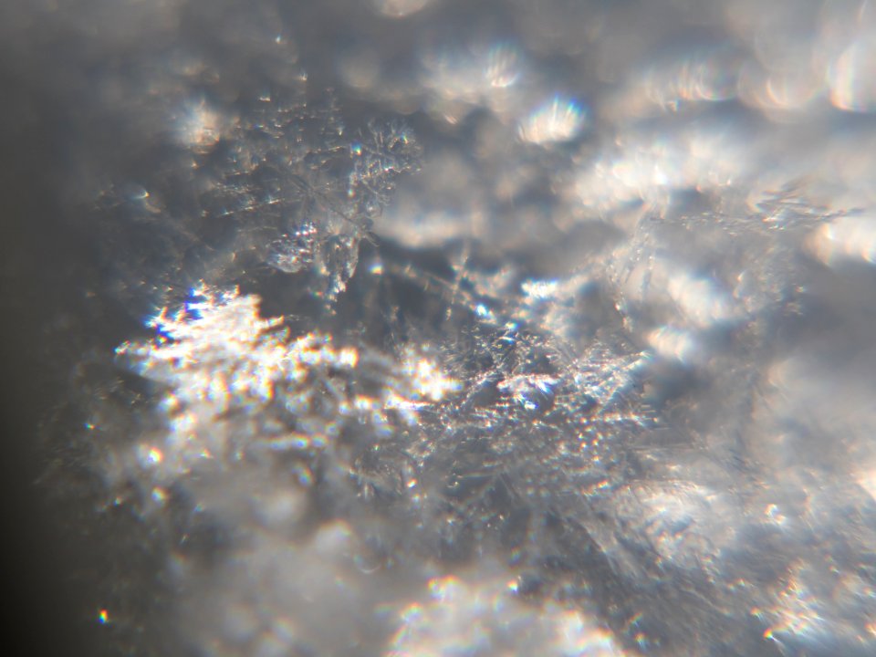 Snow crystals glittering in strong direct sunlight 29