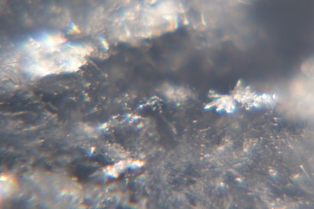 Snow crystals glittering in strong direct sunlight 24 - cropped