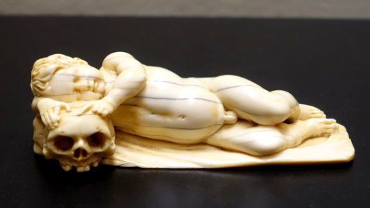 Sleeping putto with skull, probably Netherlands, 1600s, ivory - Museum Schnütgen - Cologne, Germany - DSC09951 photo