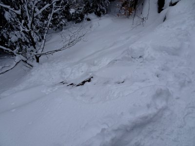 Slide path down steep mountain rock