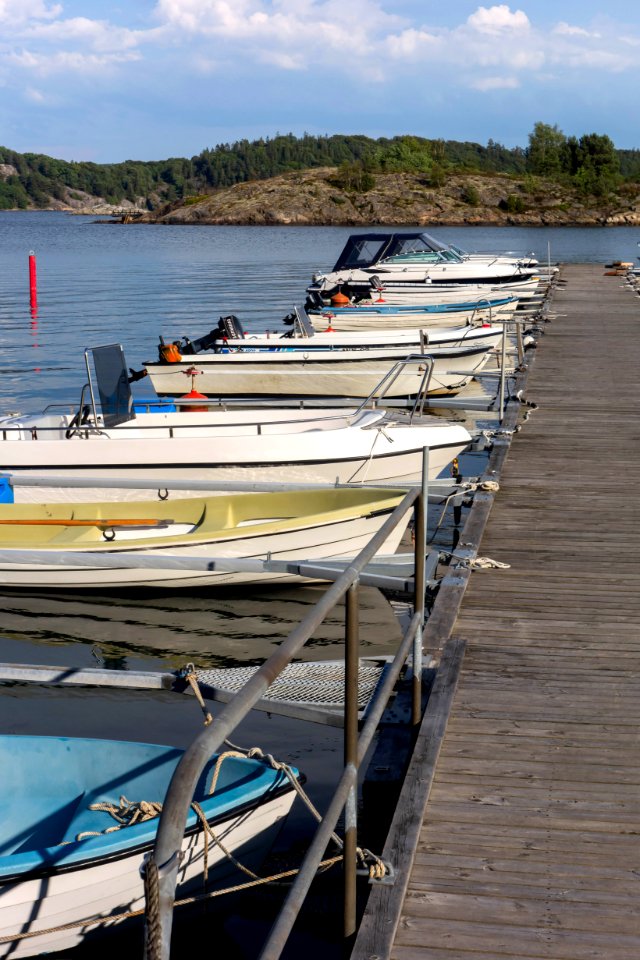 Small motorboats at a jetty in Holma marina