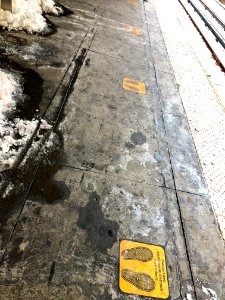 Social Distancing signs on platform of Prospect Park Subway Station during 2020 COVID pandemic