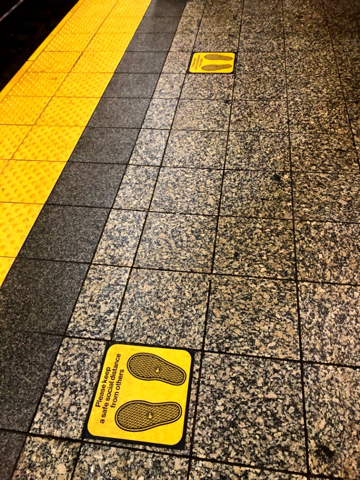 Social Distancing sign at Atlantic Avenue Station Brooklyn during COVID pandemic