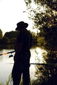 Fisherman fishing lake photo