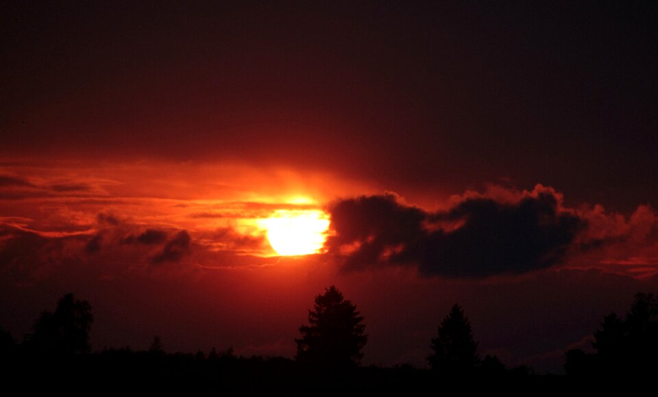 Setting sun afterglow clouds photo