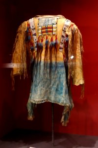 Shirt, Apache, early 20th century, with beads and human hair, view 1 - Glenbow Museum - DSC00561 photo