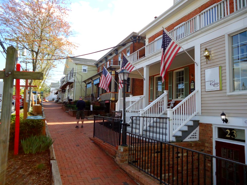 Sidewalk and man and shops and tree in Basking Ridge New Jersey