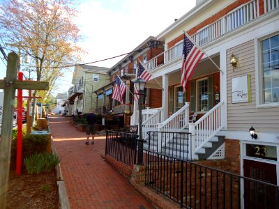 Sidewalk and man and shops and tree in Basking Ridge New Jersey photo