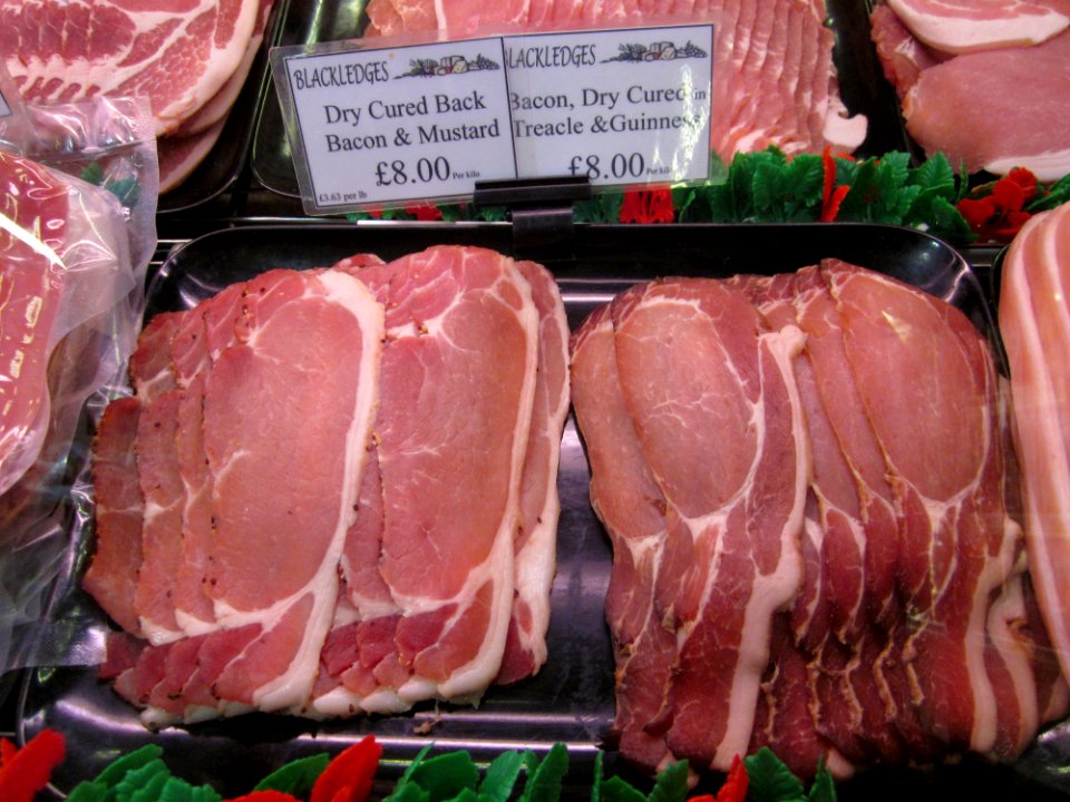 Sides of raw bacon, England