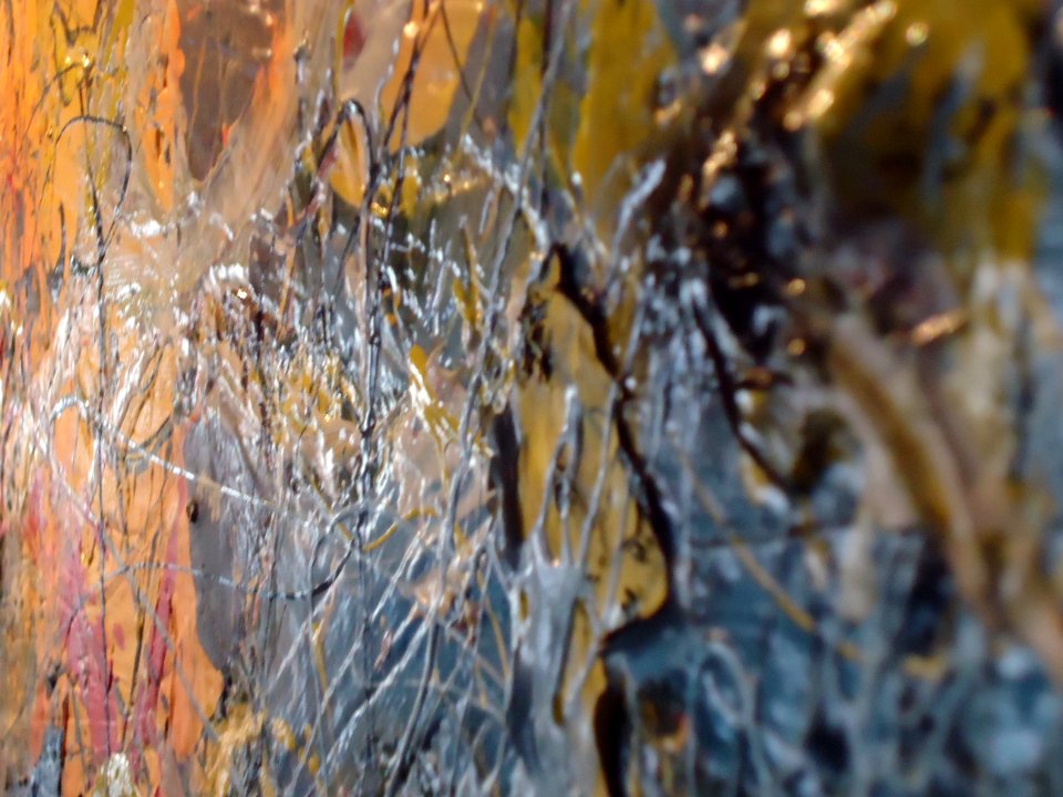 Side view of handyman drip art wall painting seen up close