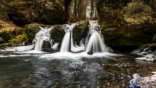 Frozen waterfall forest photo