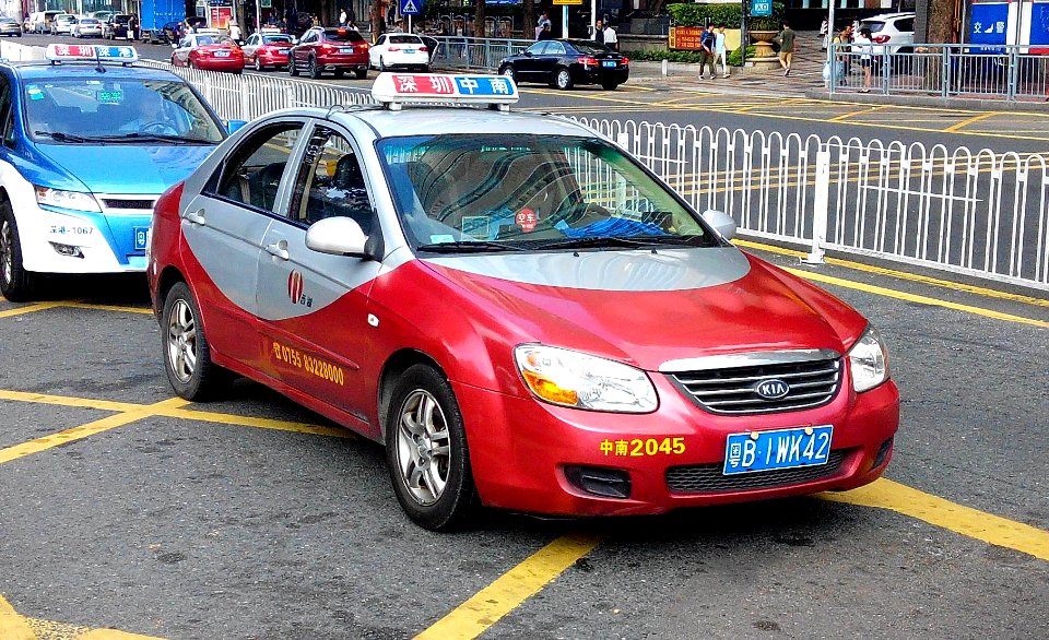 Shenzhen KIA red taxi 2