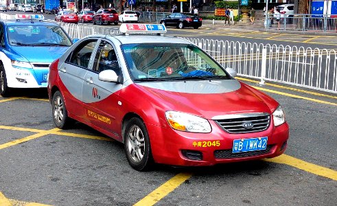 Shenzhen KIA red taxi 2