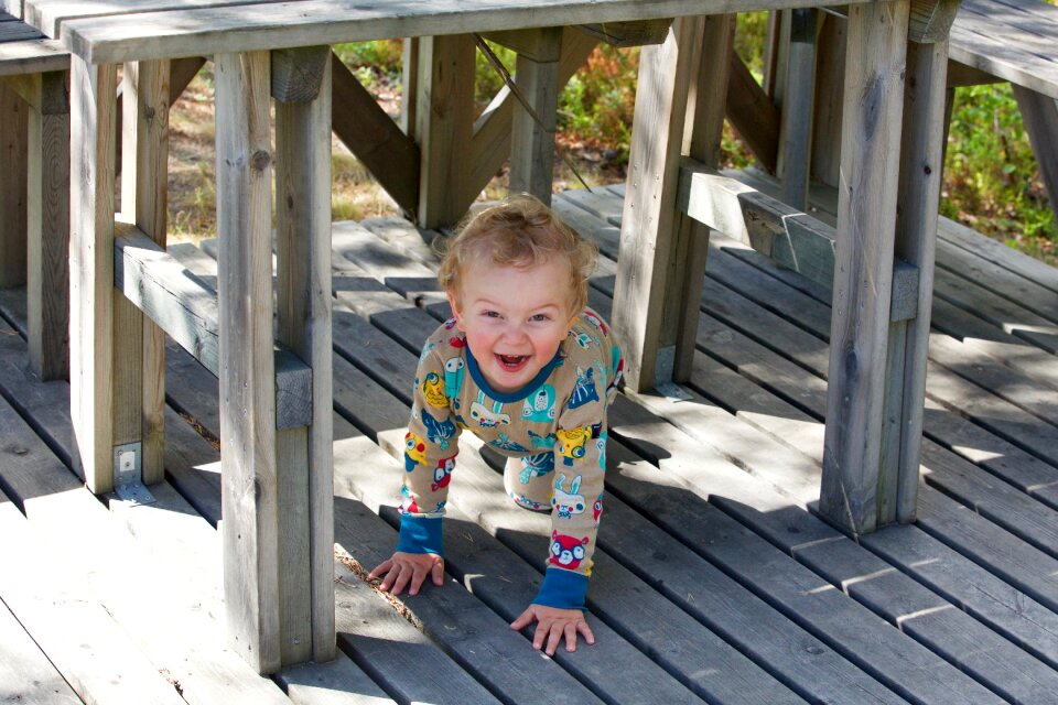 Under the table child laugh