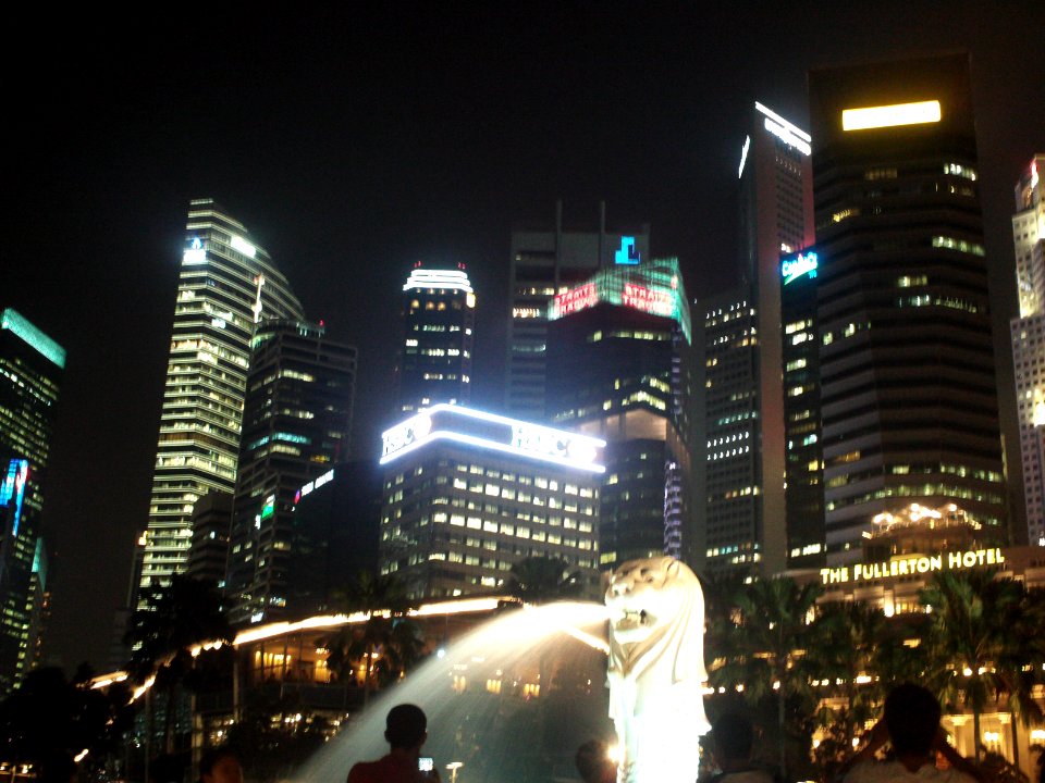 Singapore Merlion and skyscrapers in the background photo