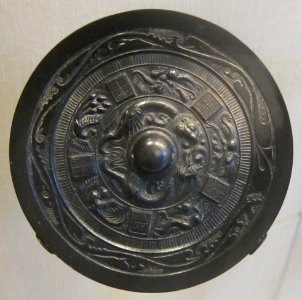 Six Dynasties period bronze mirror with dragon and kirin design, HAA