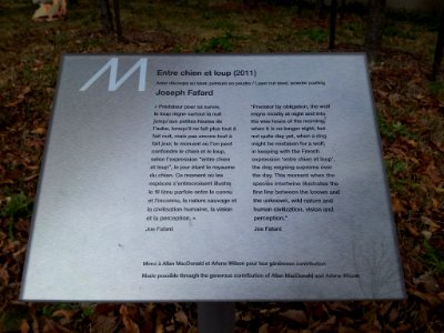 Signage for "Entre chien et loup" public art piece at Jardin de sculptures in Winnipeg, Manitoba