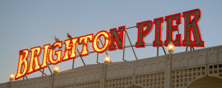 Sign at Palace Pier, Brighton (January 2017, seen at sunset)