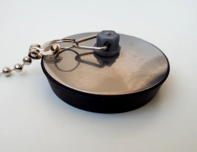Sink plug with metallic top - A