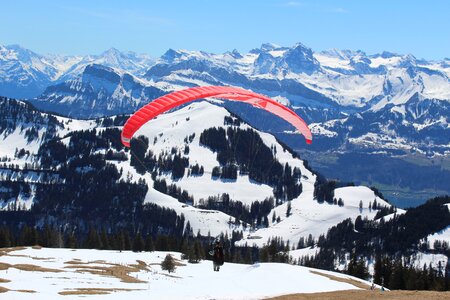 Paraglider winter scape switzerland