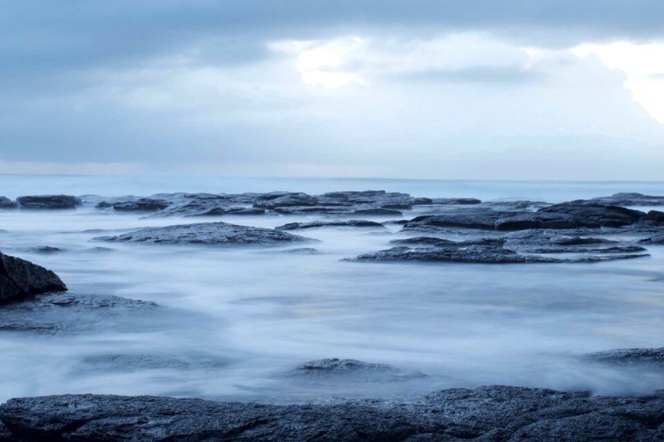 Rocks shore blue ocean