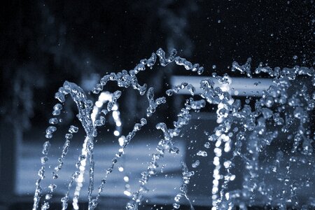 Stream sprayed drops of water photo