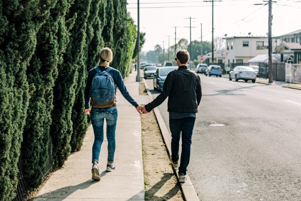Love couple holding hands woman