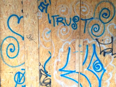 Sprayed graffiti on a wooden wall, like ornaments - Amsterdam city photo