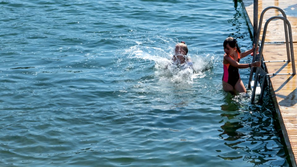 Splash made by a girl jumping into the sea in Röe Sandvik, Lysekil, Sweden 2 photo