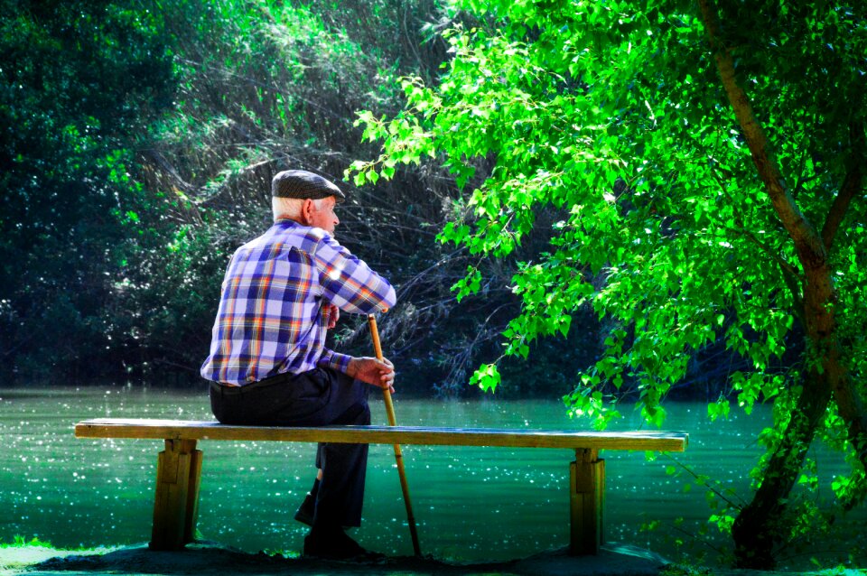 Elder meditating his life watch the water