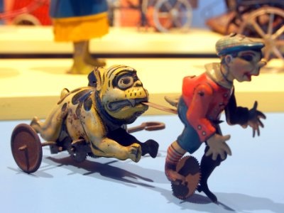 Speelgoedmuseum Deventer, clockwork wind-up tin toy, boy chased by dog
