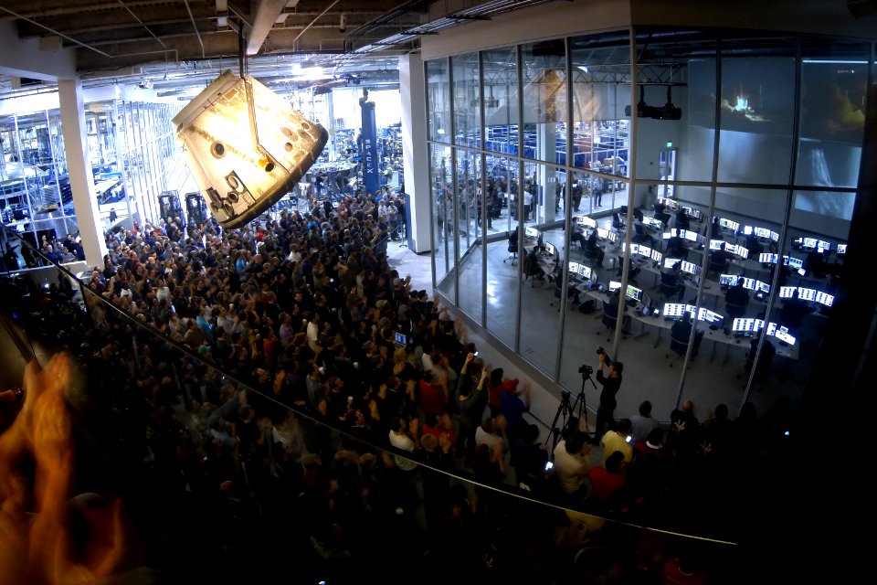 SpaceX employees watch the Falcon 9 SES-8 launch from Spacex headquarters in Hawthorne, CA